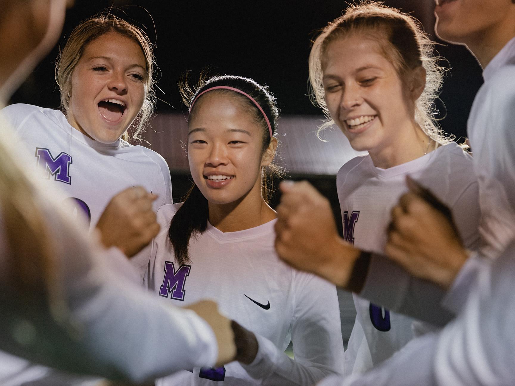 Women's soccer student-athletes celebrating